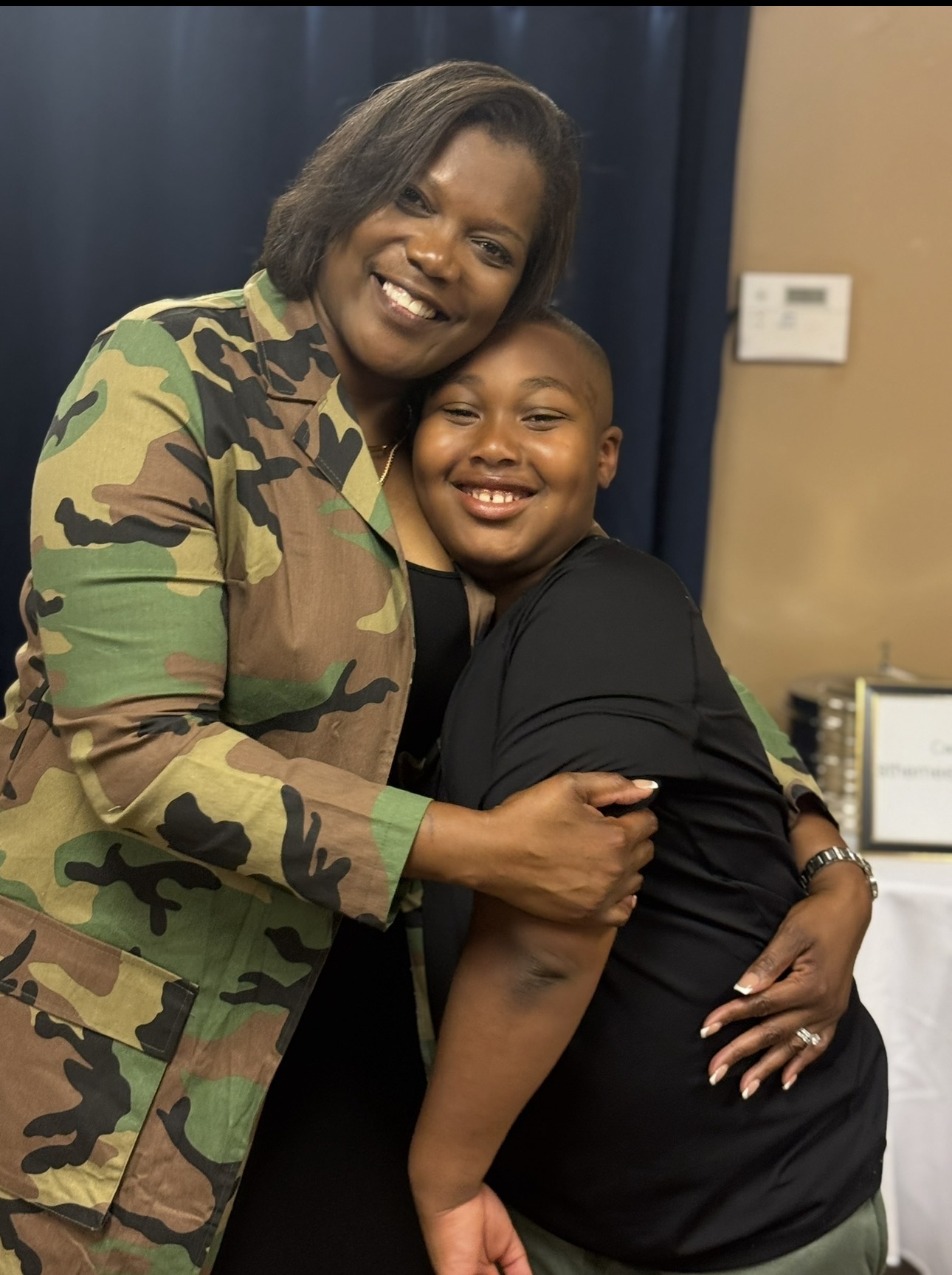 A ministry leader sharing an encouraging embrace with a young person