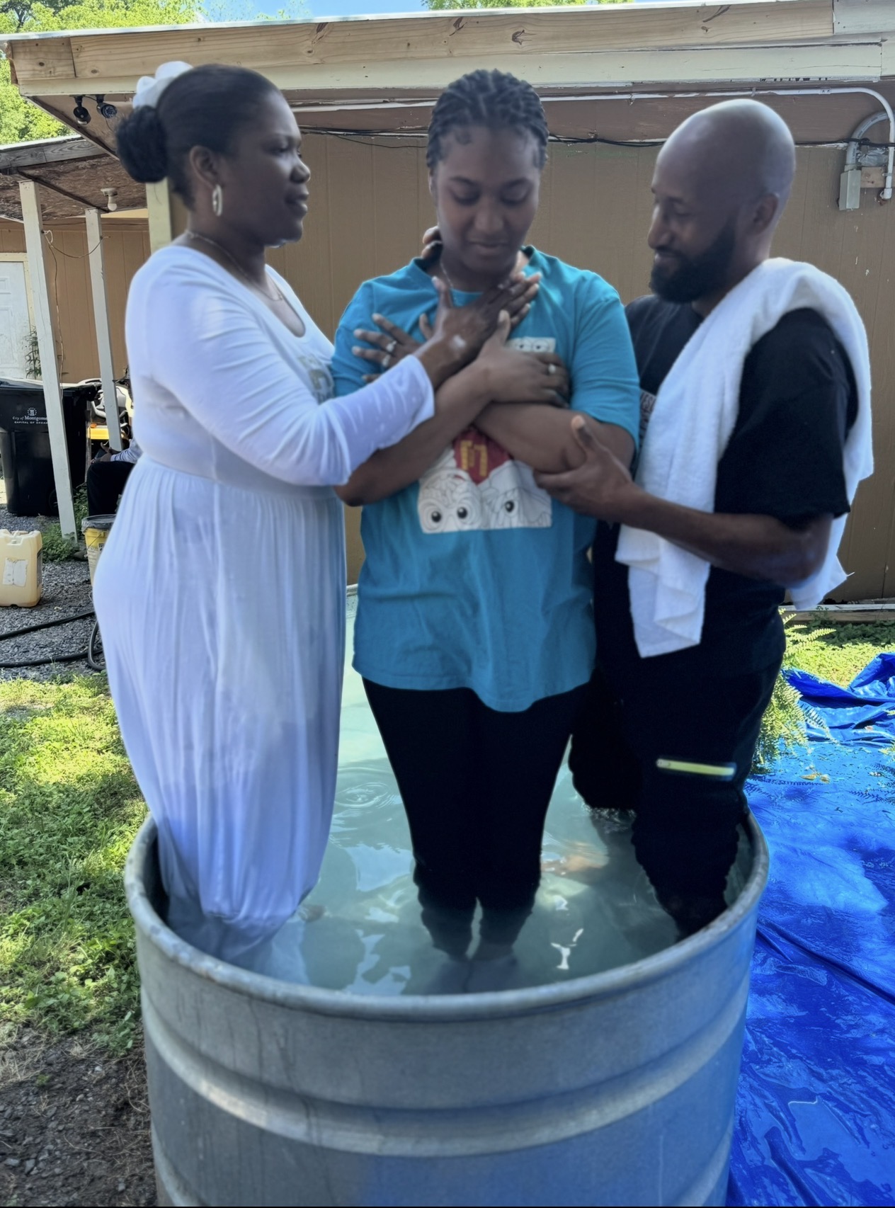 A baptism and prayer moment at The Meeting Place