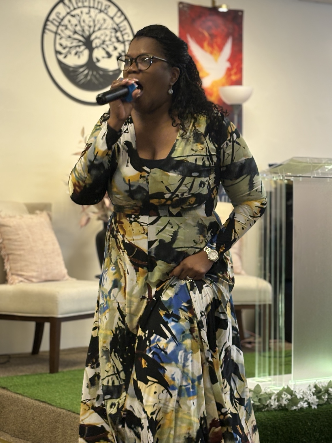 A singer leading worship with a microphone