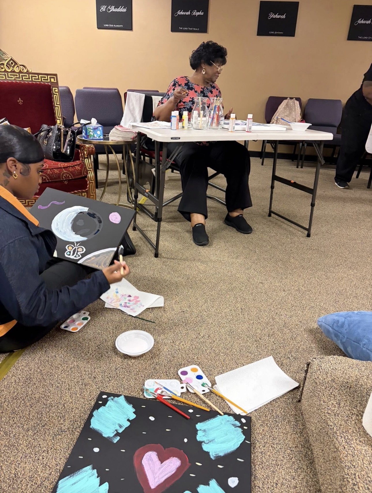 Women painting together during a creative ministry fellowship