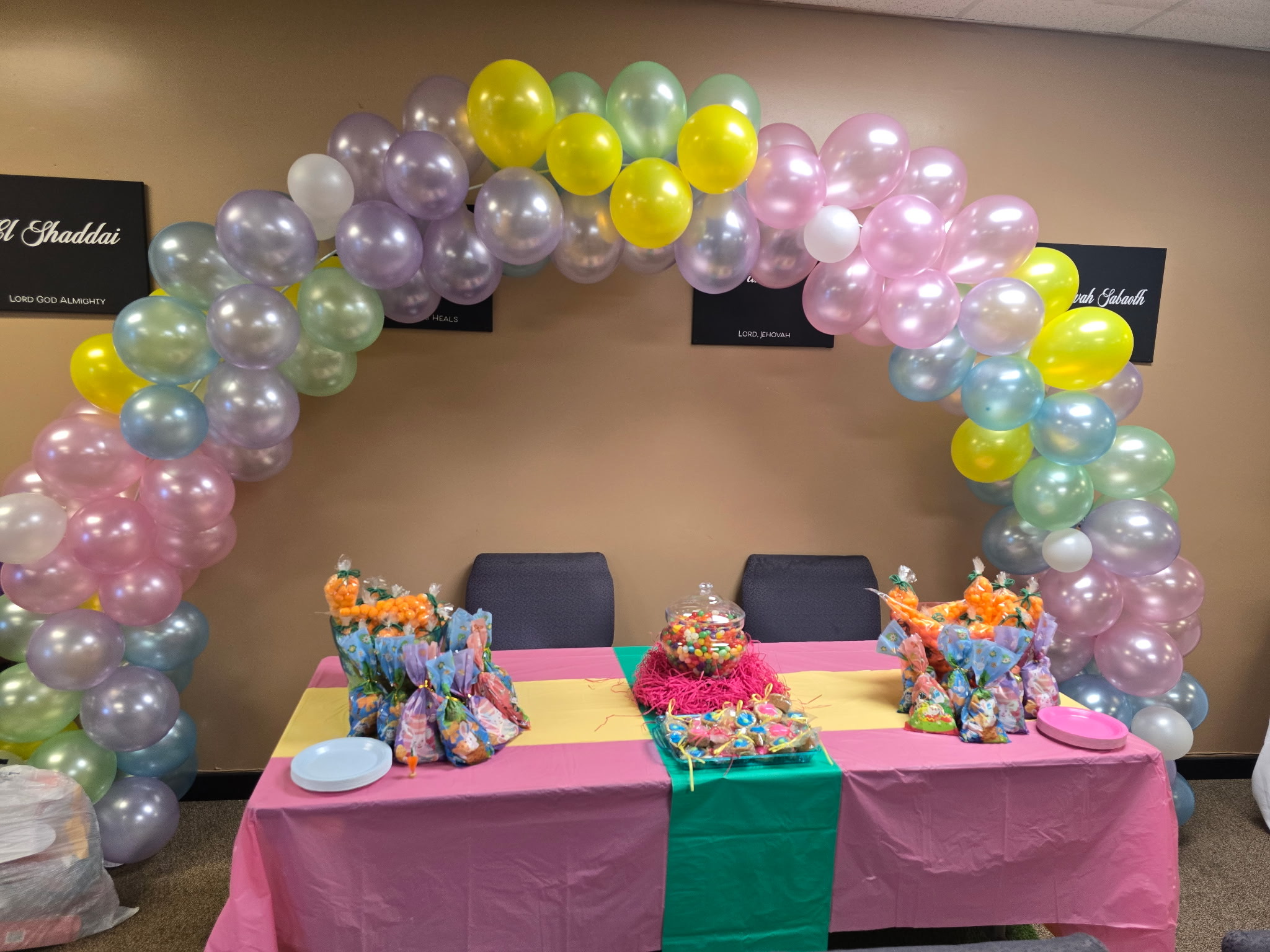 Colorful balloon arch and Easter treats prepared for families